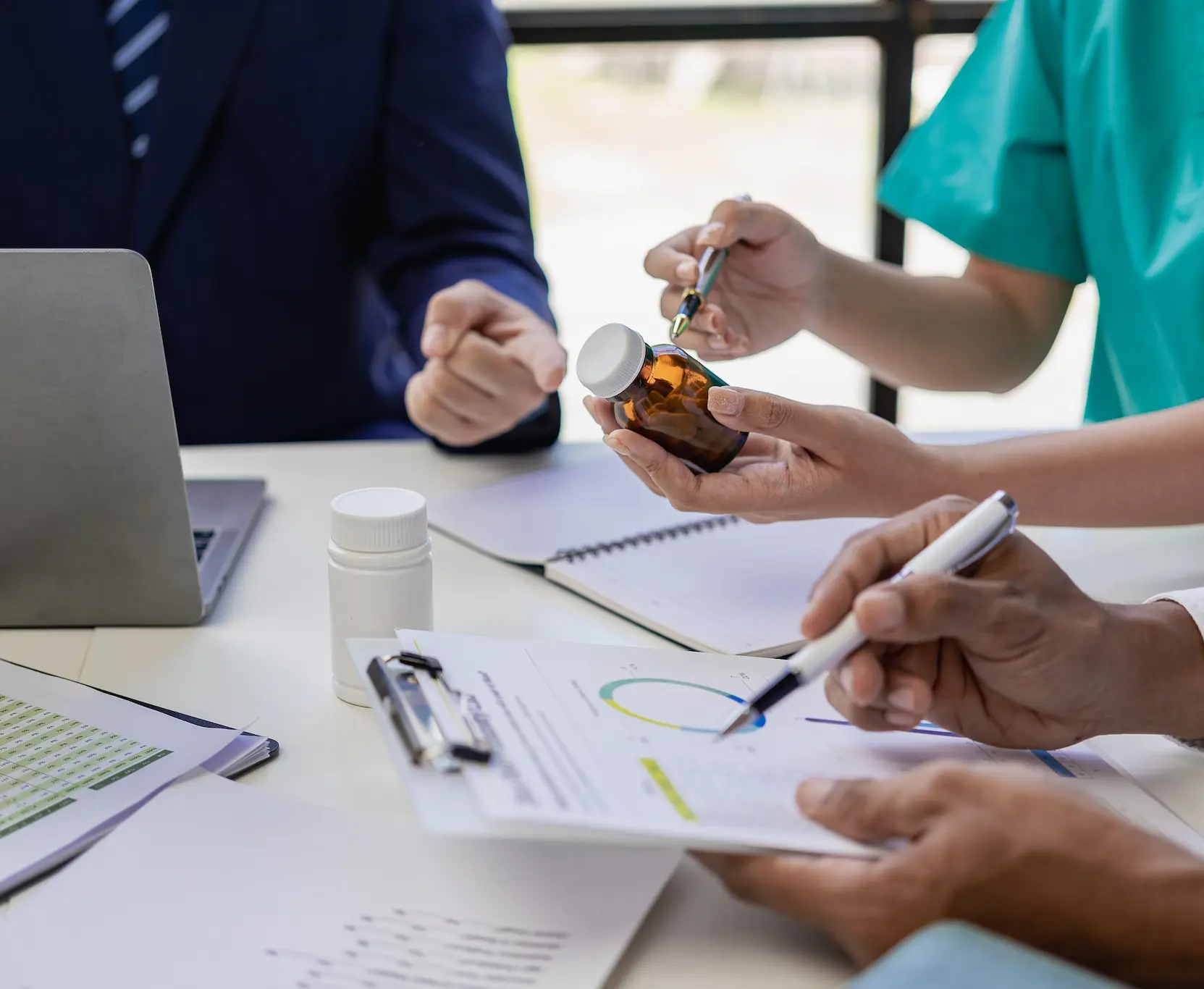 Healthcare professionals reviewing drug testing results and compliance documentation.